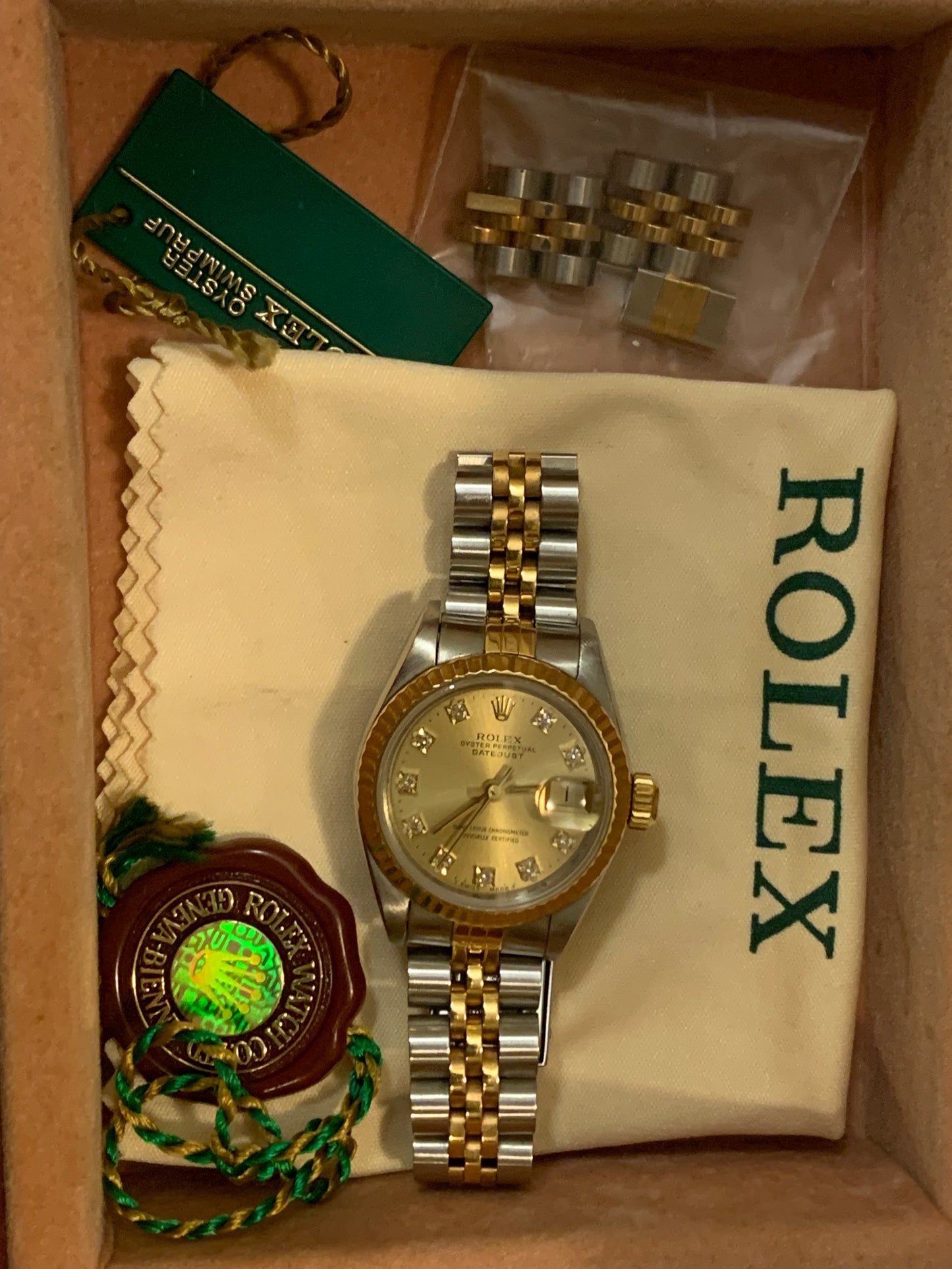 Rolex Oyster Perpetual Datejust 69173 Lady 26mm 18k Gold and Steel Watch Champagne Diamond Dial